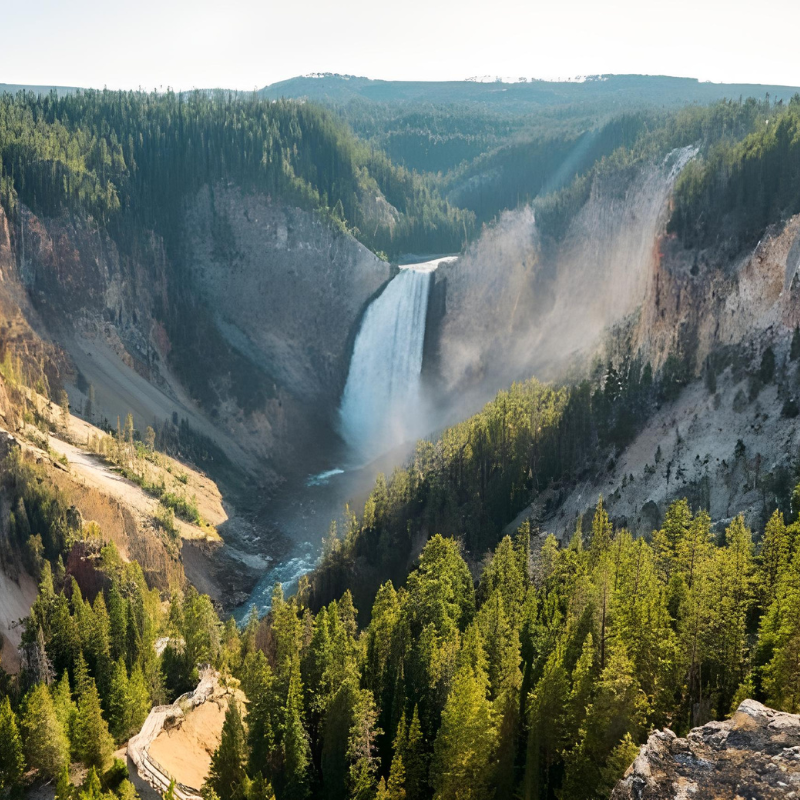 A stunning view of Yellowstone Falls in Wyoming, showcasing the majestic waterfall surrounded by natural beauty.