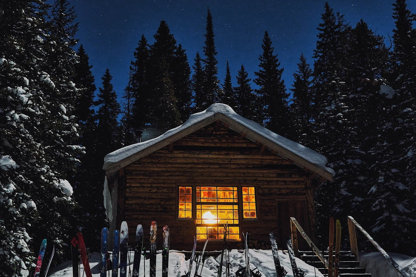 A cozy cabin in the snow with skis 